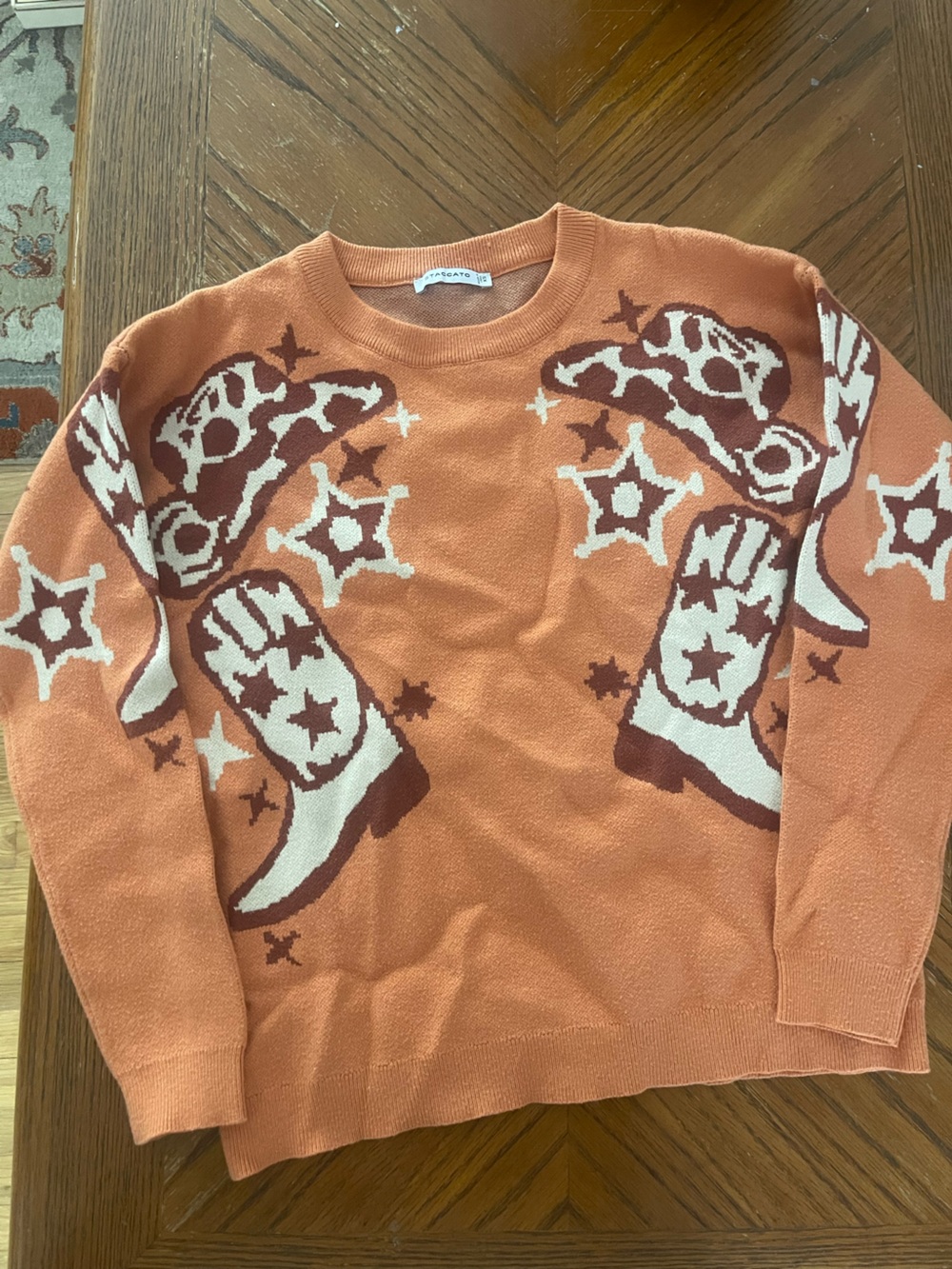 Staccato Rust Orange Crewneck Sweater with Boot Motif